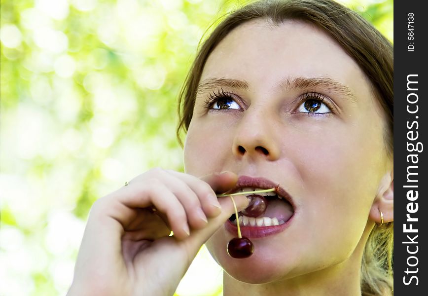 Woman Eating Sour Cherry