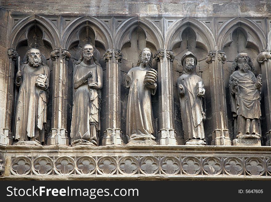 Sculptures into the arches on a facade of a ancient church in Estella, Navarra, Spain