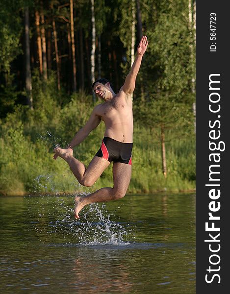 Happy jump in lake with smile. Happy jump in lake with smile