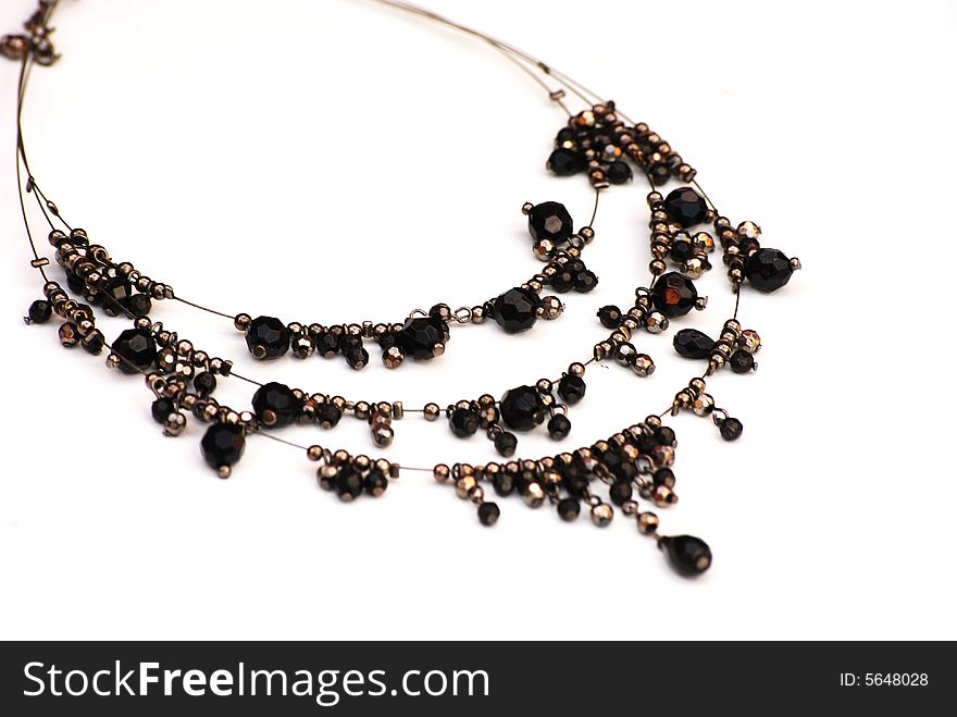 Isolated shot of a fancy black beaded necklace. Isolated shot of a fancy black beaded necklace