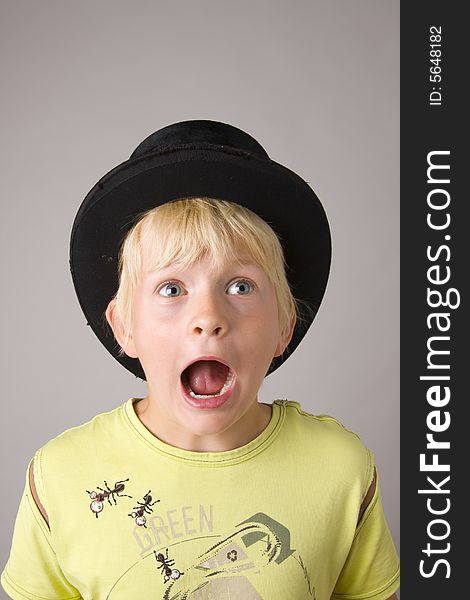Portrait of a young boy shouting madly