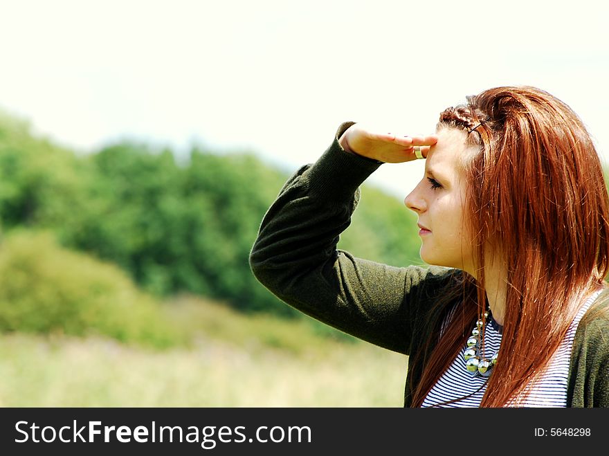 Shot of a young woman looking into the distance