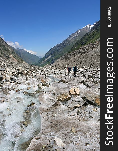 Hikers in mountains, Caucasus mountain, snow top, bezengi