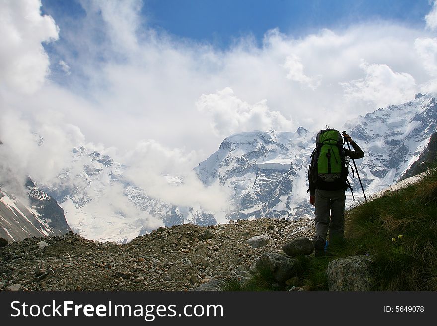 Backpackers silhouette, Hikers on the cliff in mountain