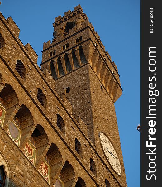 An original glimpse of Palazzo Vecchio in Florence at the sunset hour