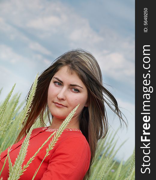 Thoughtful girl with long windswept hair