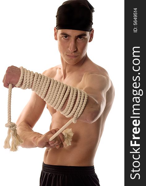 Muscular builder man with rope around hands. Muscular builder man with rope around hands