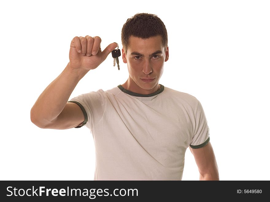 Young man holding a key of the car