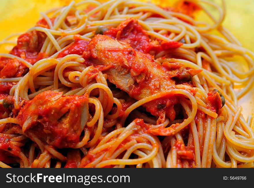 Dark Bran spaghetti pasta with tuna fish fillets sauce and tomato. Dark Bran spaghetti pasta with tuna fish fillets sauce and tomato.