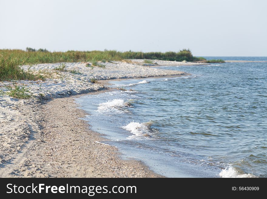 Deserted seascape in summer morning light