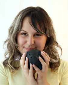 Young Lady Holding Piggy Bank Royalty Free Stock Image