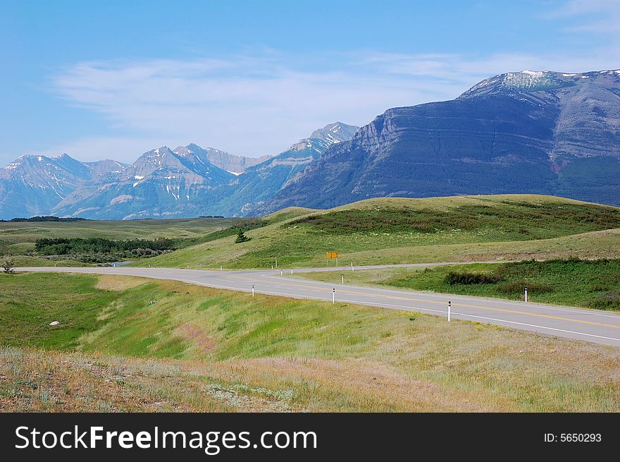 Highway and mountains in waterton national park, alberta, canada. Highway and mountains in waterton national park, alberta, canada