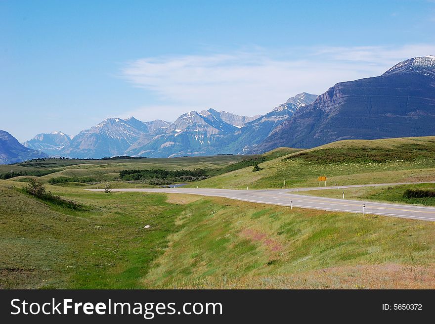 Highway and mountains in waterton national park, alberta, canada. Highway and mountains in waterton national park, alberta, canada