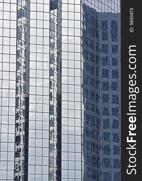 Modern glass office buildings with reflection