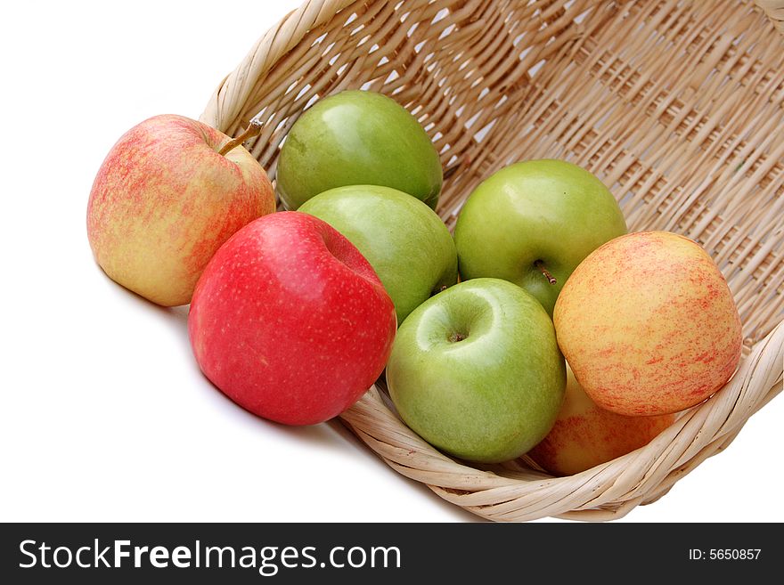 Basket with apples isolated on white background