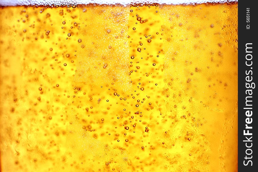 Glass of beer close-up with bubbles