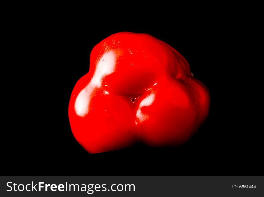 Beautiful pimiento on black background, studio style. Beautiful pimiento on black background, studio style