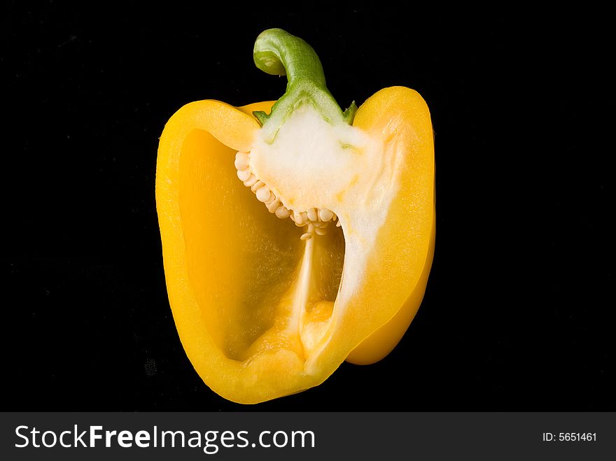 Beautiful dissected pimiento on black background, studio style. Beautiful dissected pimiento on black background, studio style