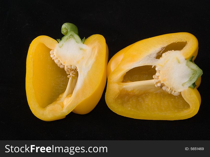 Beautiful dissected pimiento on black background, studio style. Beautiful dissected pimiento on black background, studio style