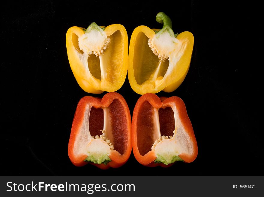 Beautiful dissected pimiento on black background, studio style. Beautiful dissected pimiento on black background, studio style