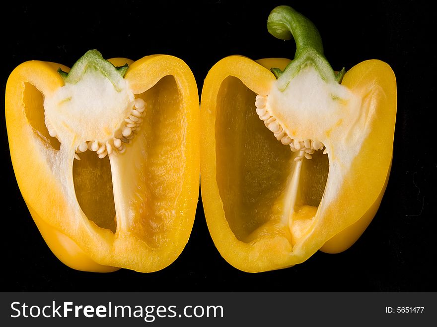 Beautiful dissected pimiento on black background, studio style. Beautiful dissected pimiento on black background, studio style