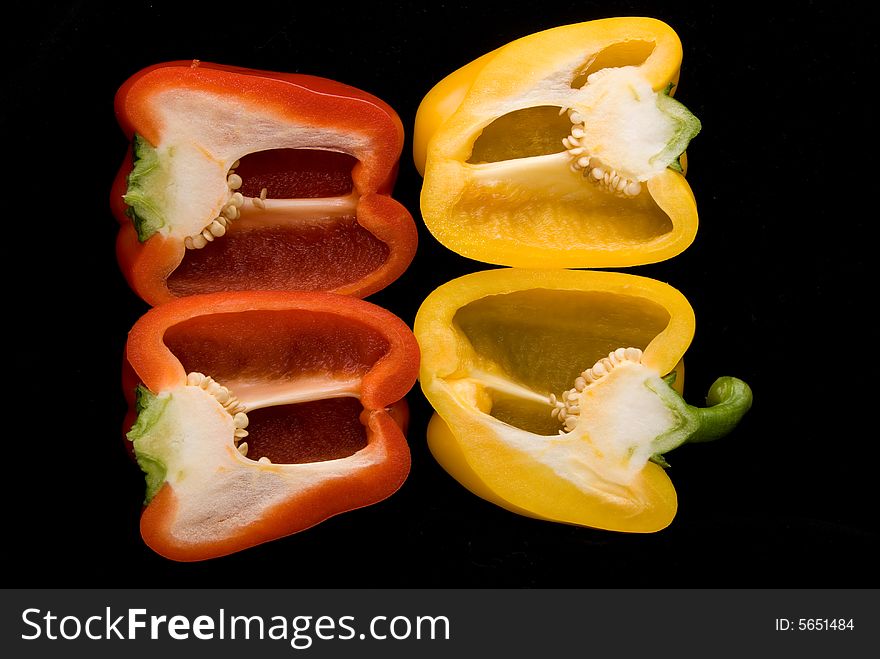 Beautiful dissected pimiento on black background, studio style. Beautiful dissected pimiento on black background, studio style