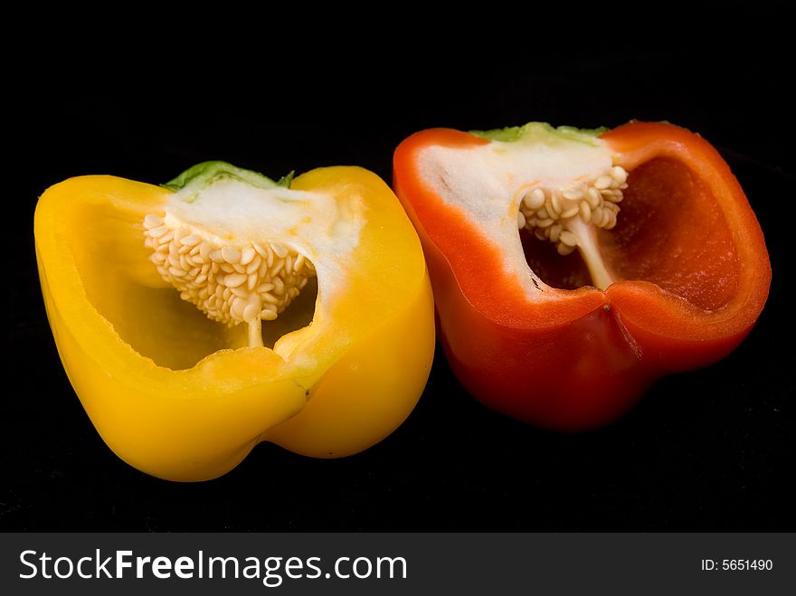 Beautiful dissected pimiento on black background, studio style. Beautiful dissected pimiento on black background, studio style