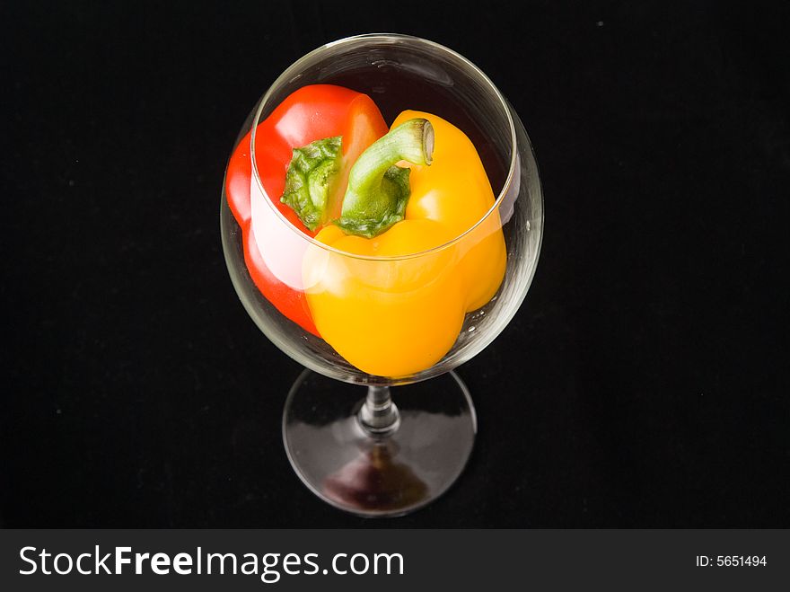 Beatiful dissected Pimiento united in bright goblet on black background. Beatiful dissected Pimiento united in bright goblet on black background