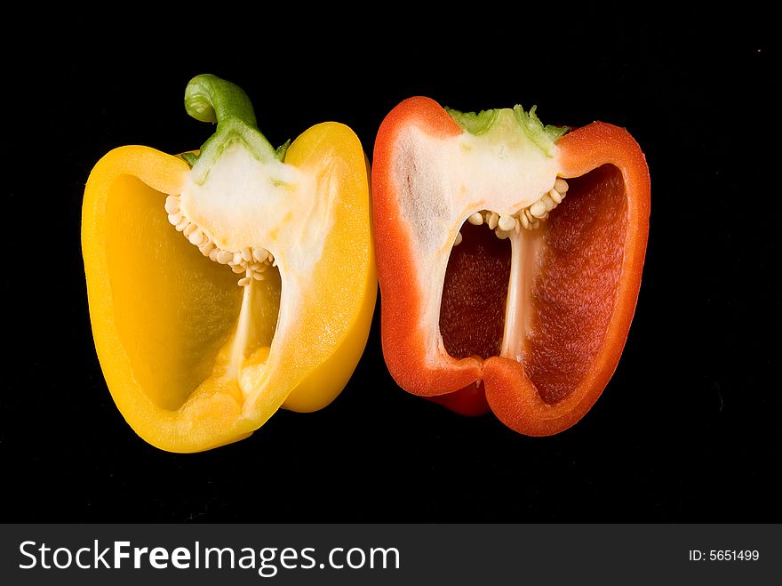 Beautiful dissected pimiento on black background, studio style. Beautiful dissected pimiento on black background, studio style