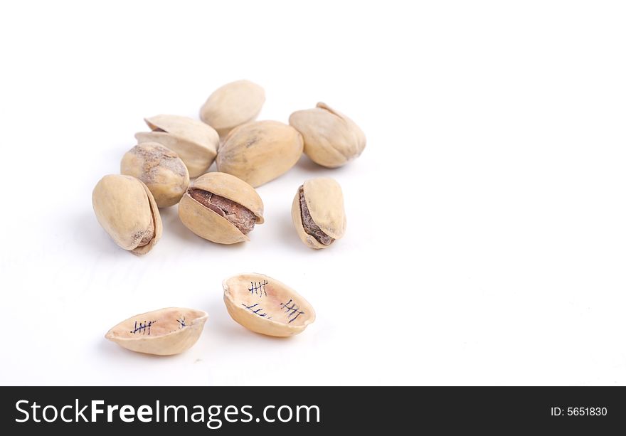 Solted pistachio nut at white isolated background