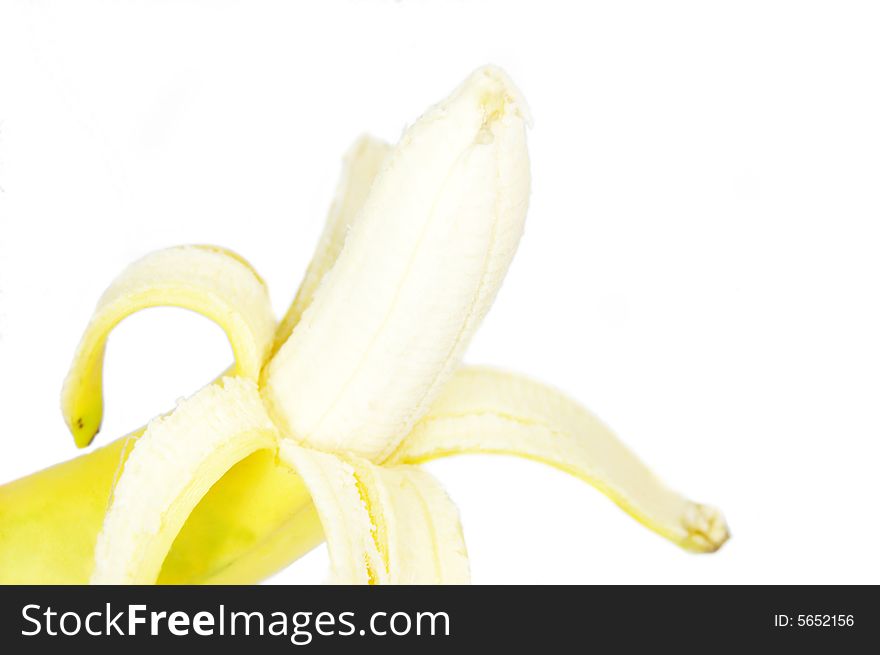 A single peeled fresh banana isolated on white background