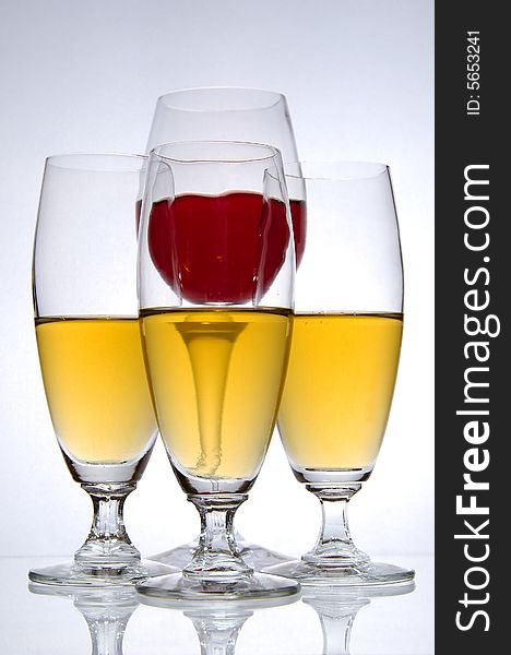 Four glasses of wine on white background