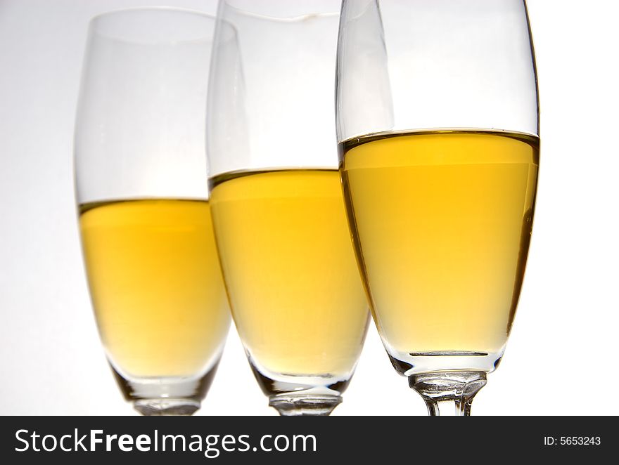 Three glasses of wine on white background