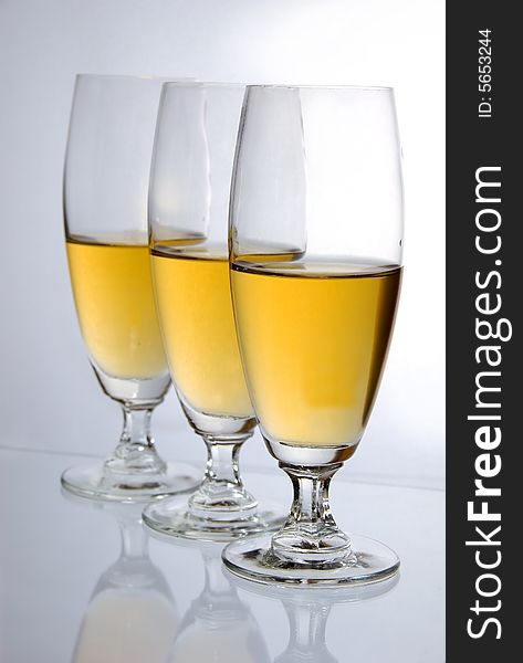 Three glasses of wine on white background