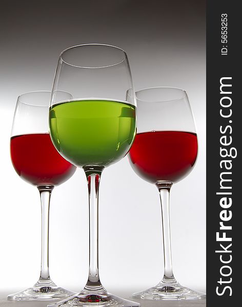 Three glasses with color drinks