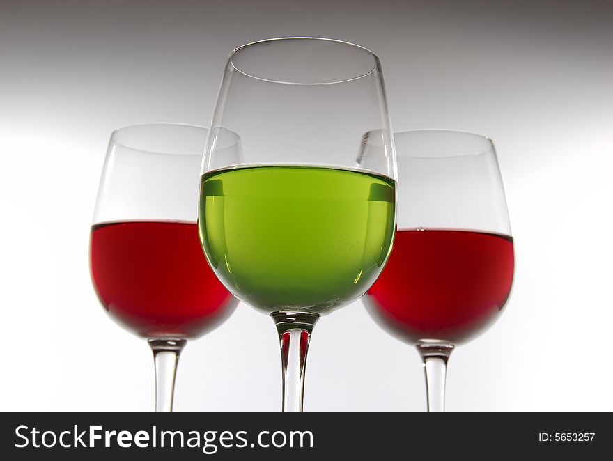 Three glasses with color drinks