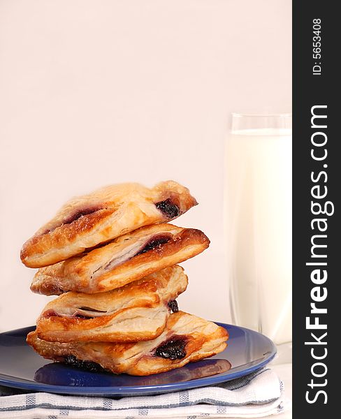 Stack Of Blueberry Turnovers With Milk