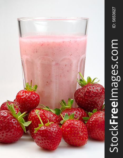 Milkshake in a glass with fresh strawberry. Milkshake in a glass with fresh strawberry.