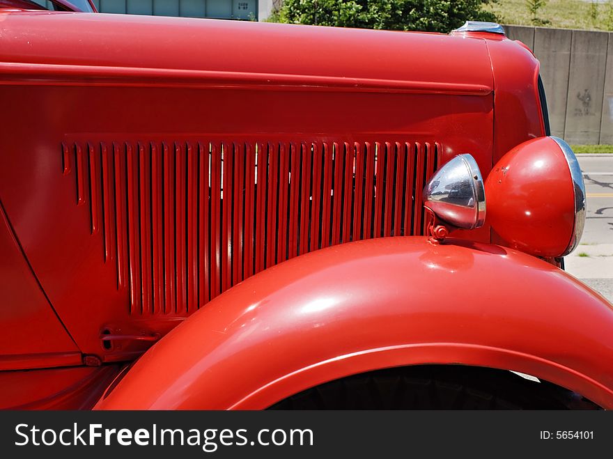Hood, fender and headlight of an antique 1937 Dodge red fire engine. Hood, fender and headlight of an antique 1937 Dodge red fire engine.