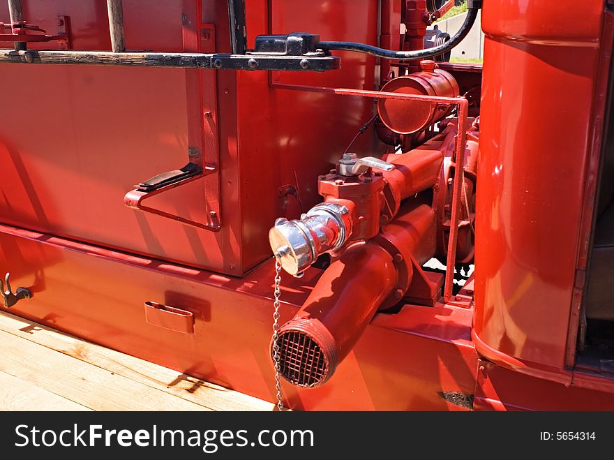 Close-up of discharge outlet and inlet pipe for water exchange on a 1937 Dodge fire engine. Close-up of discharge outlet and inlet pipe for water exchange on a 1937 Dodge fire engine.