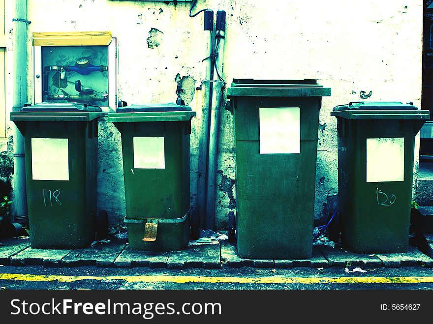 Four Rubbish Bin together with one of them larger. Four Rubbish Bin together with one of them larger