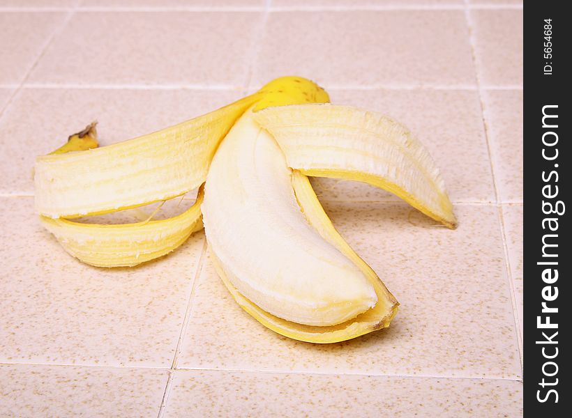 A banana on a kitchen counter top