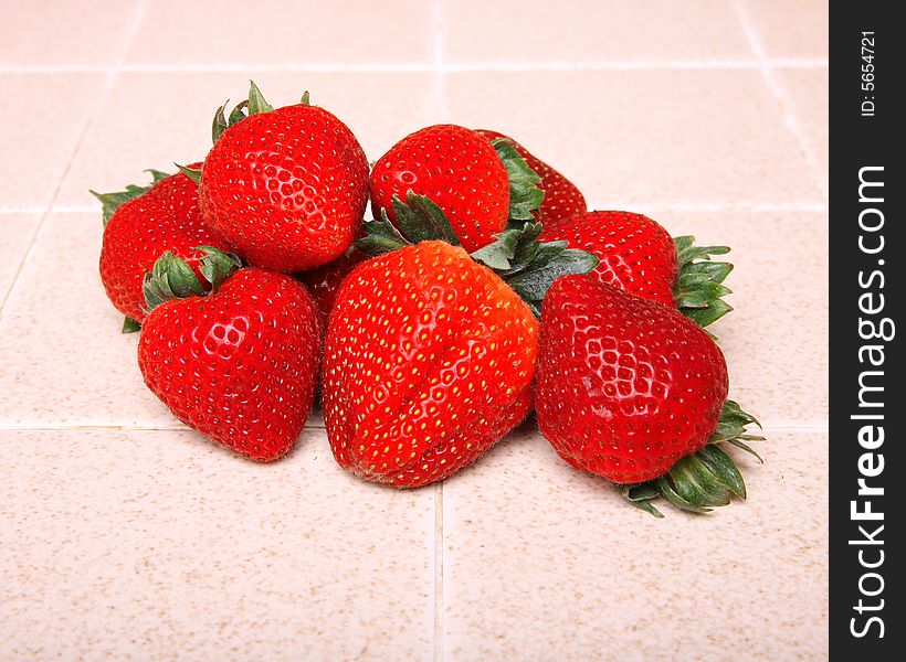 Strawberries on a kitchen counter top. Strawberries on a kitchen counter top
