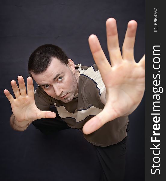 Young man closeup showing palms upwards. Young man closeup showing palms upwards