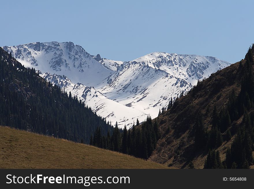 Snow mountain tops in the spring. Snow mountain tops in the spring