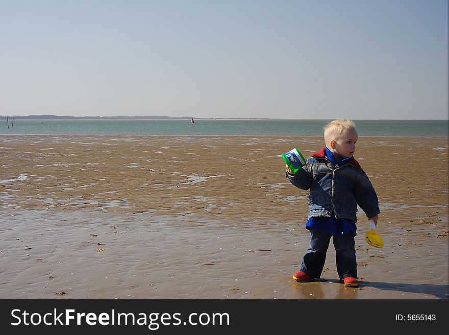 Little boy playing on the beach. Little boy playing on the beach