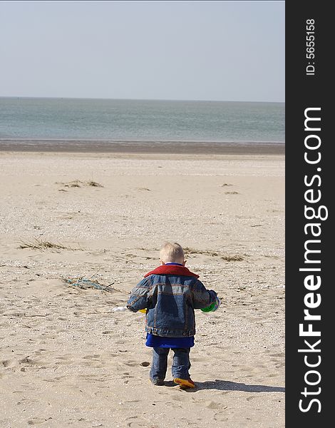 Little boy playing on the beach. Little boy playing on the beach