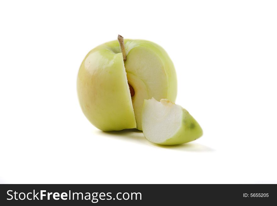 The cut green apple on a white background