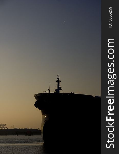 A bulkcarrier unloading in Rotterdam in the evening. A bulkcarrier unloading in Rotterdam in the evening