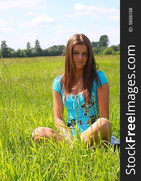 Young woman on the meadow in the summer. Young woman on the meadow in the summer.